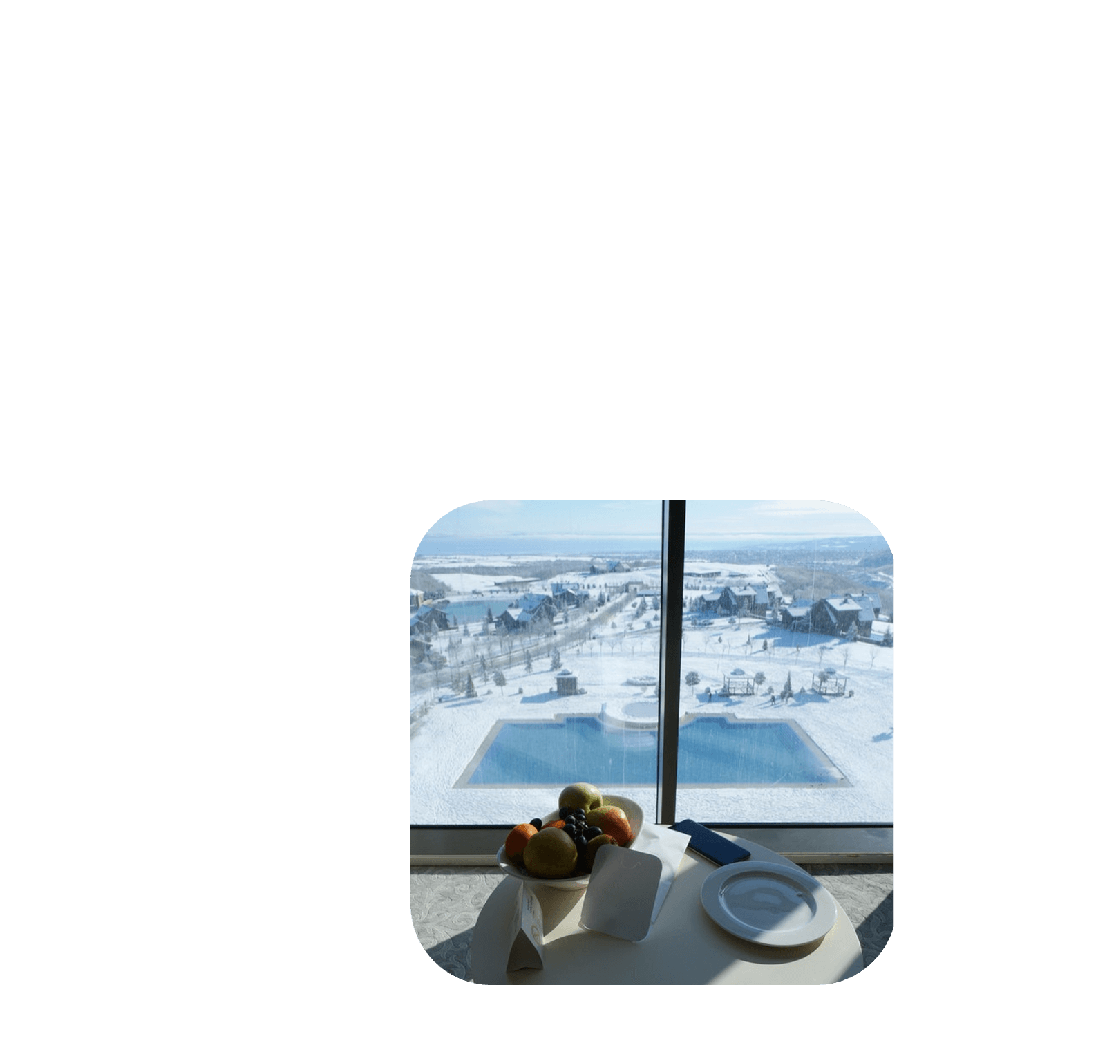 winter hotel resort with window view to snow and pool